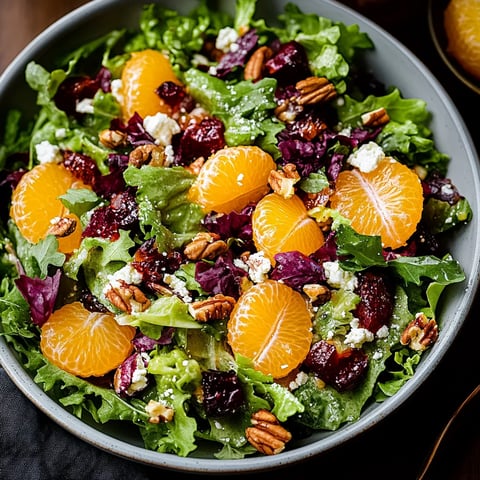 A vibrant bowl with oranges and creamy avocado.