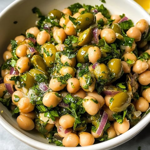 A bowl of beans and vegetables.